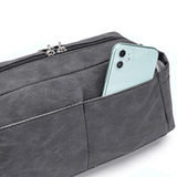 A gray Pram Caddy toiletry bag with a cell phone inside. (Brand: Mother and Baby)
