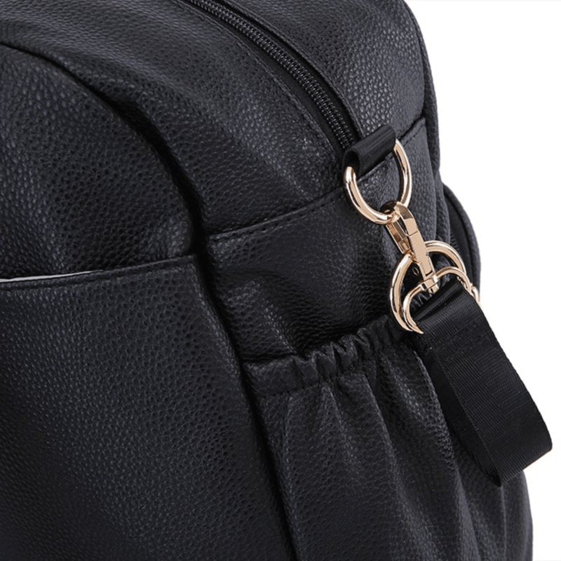 A Lily - Black diaper bag with a gold buckle from Mother and Baby.