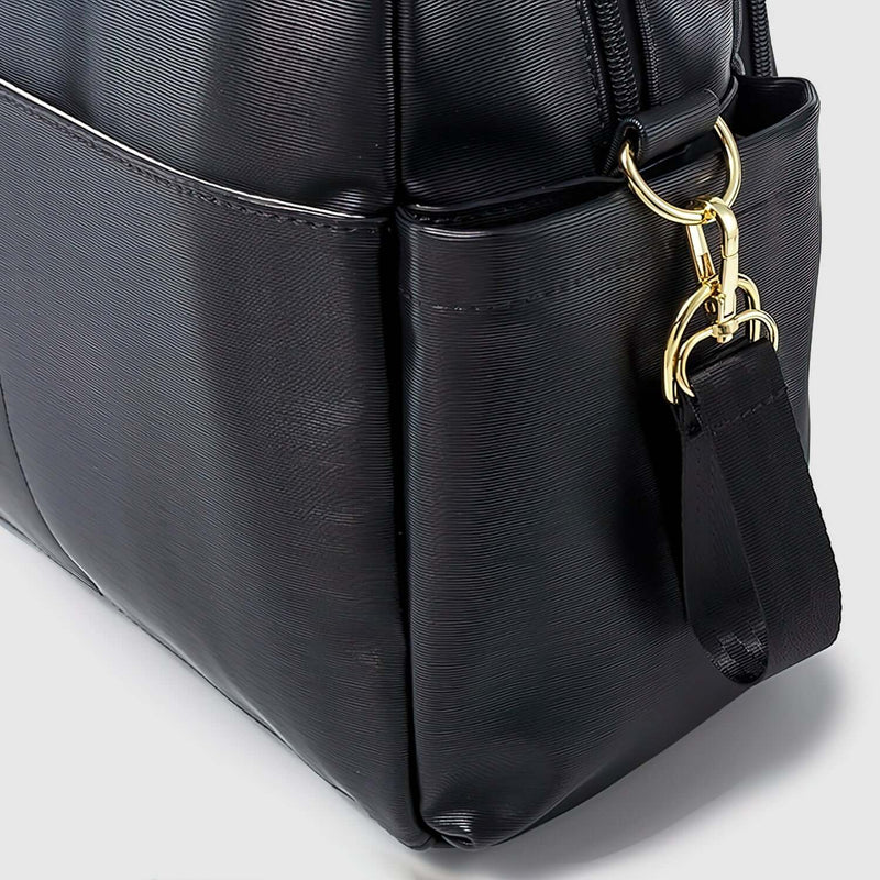 A black Pram Organiser with gold hardware from Mother and Baby.