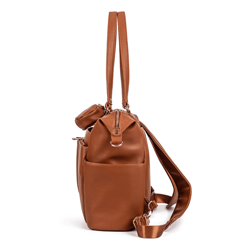 A Ivy - Caramel leather bag with a shoulder strap by Mother and Baby.