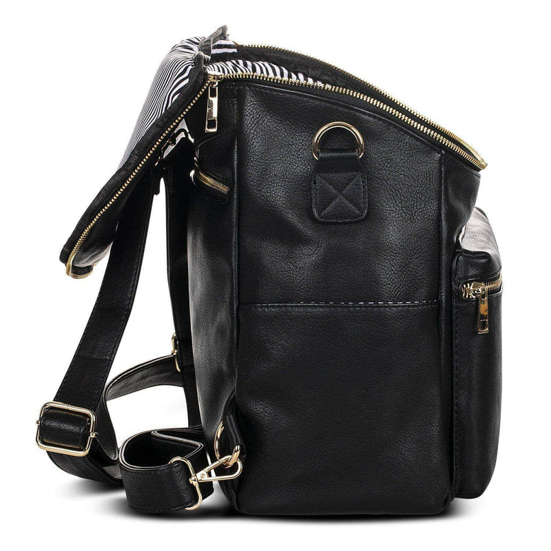 A Sophia - Black leather backpack with a zippered compartment by Mother and Baby.