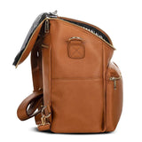 A Sophia - Caramel backpack by Mother and Baby with a zippered compartment.