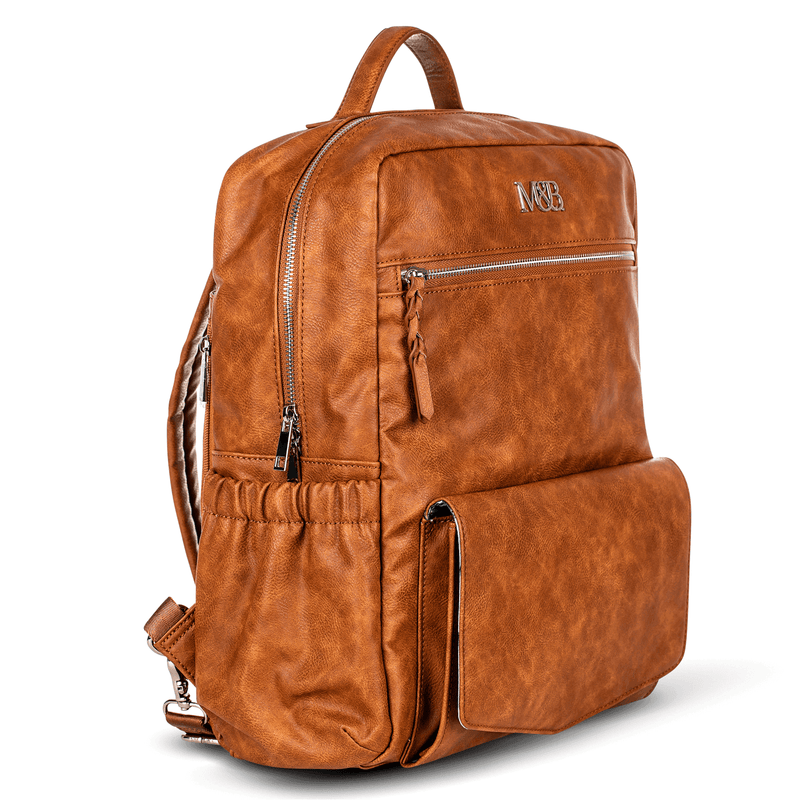 A Mother and Baby Willow - Tan leather backpack with a zippered compartment.