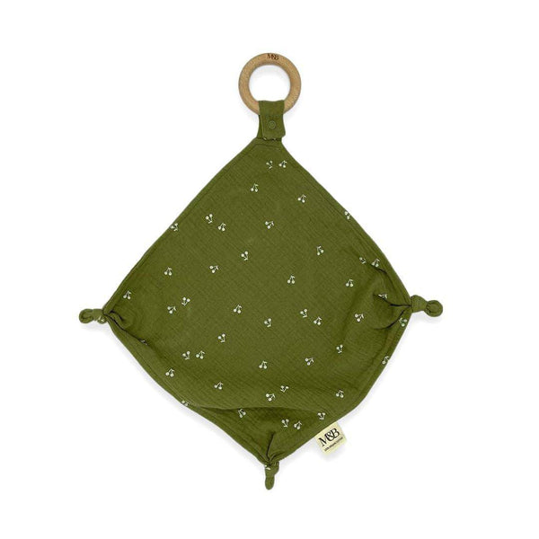 A green wooden Comforter Swaddle with white dots on it by Mother and Baby.