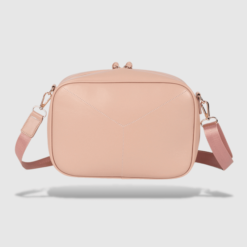 An Evelyn - Cross Body bag by Mother and Baby with a pink strap.