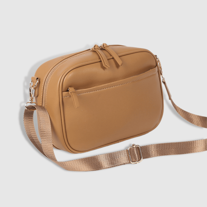 An Evelyn - Cross Body bag with a strap made by Mother and Baby.