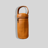 An Insulated Bottle Holder - Caramel by Mother and Baby on a gray background.