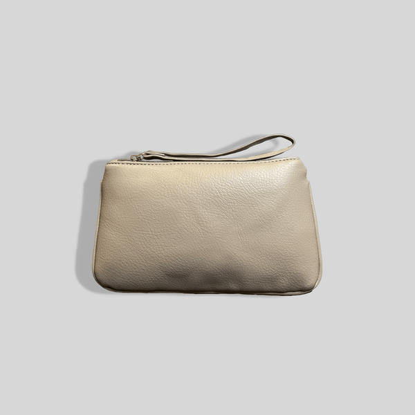 A beige leather clutch bag on a grey background, the Mother and Baby Zip Purse - Grey.