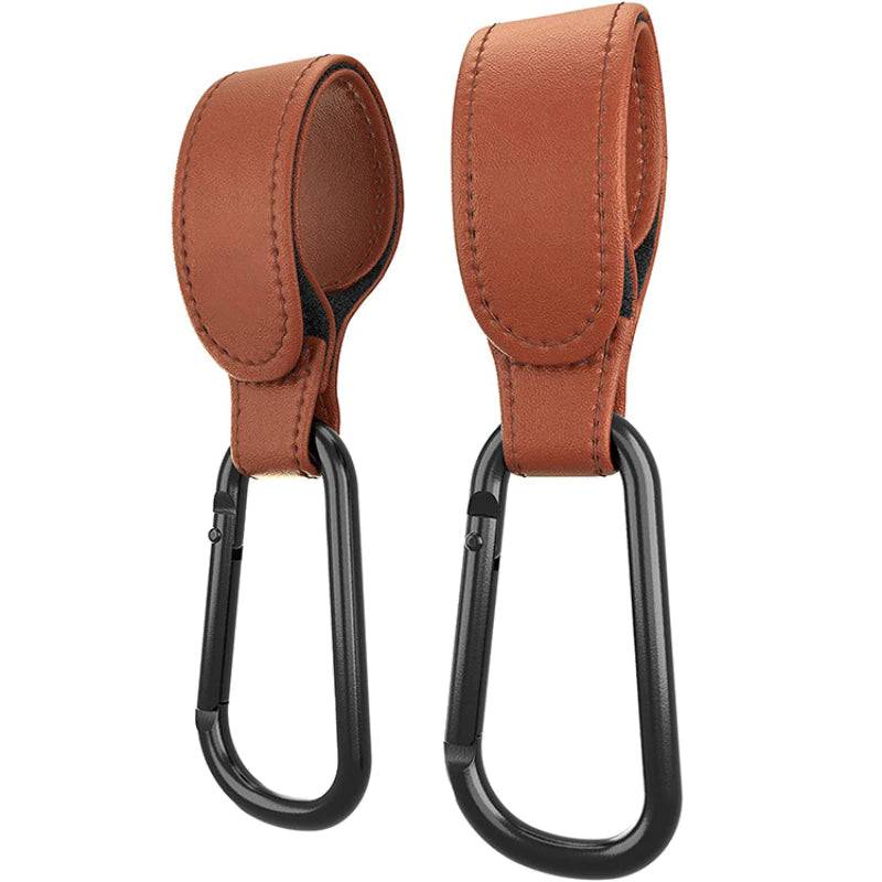 A pair of Mother and Baby Luxe Stroller Strap carabiners on a white background.