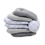 A stack of Mother and Baby Adjustable Breast Feeding Pillows on top of each other.