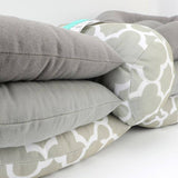 A stack of Mother and Baby Adjustable Breast Feeding Pillows stacked on top of each other.