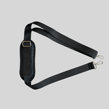 A Mother and Baby black leather strap with a metal buckle.