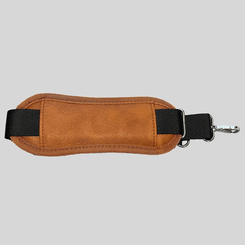 A Padded Adjustable Shoulder Strap - Caramel with a black buckle by Mother and Baby.