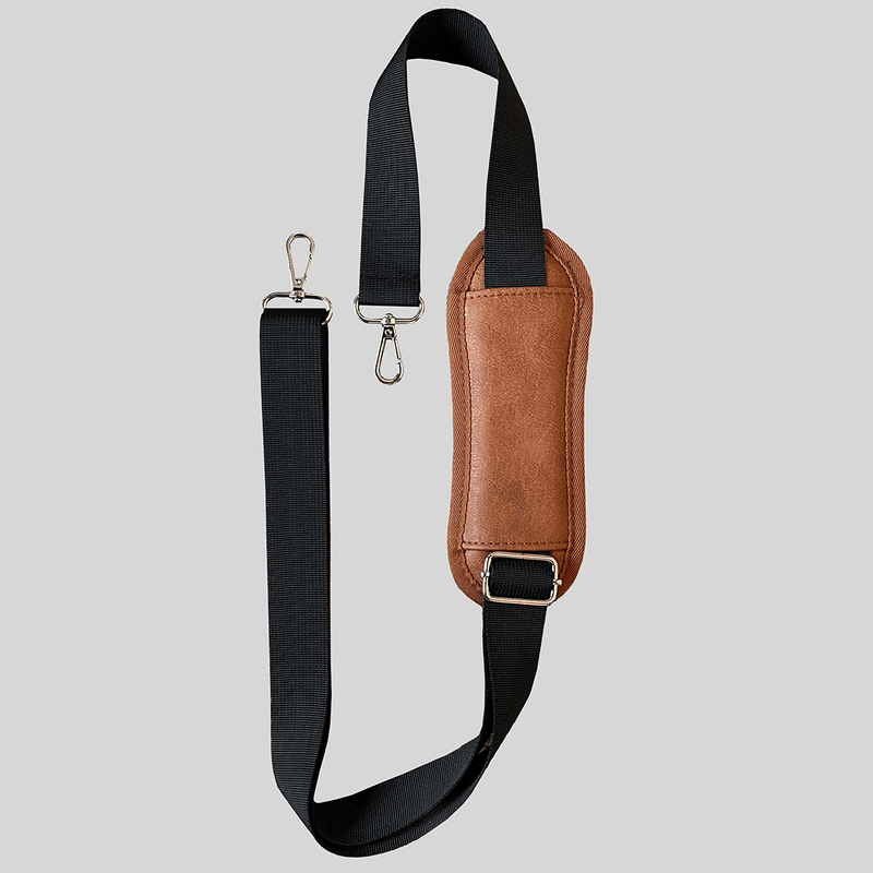 A Padded Adjustable Shoulder Strap - Caramel sling with a black strap by Mother and Baby.